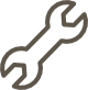 Icon of a wrench shown in a simple, brown outline on a transparent background.